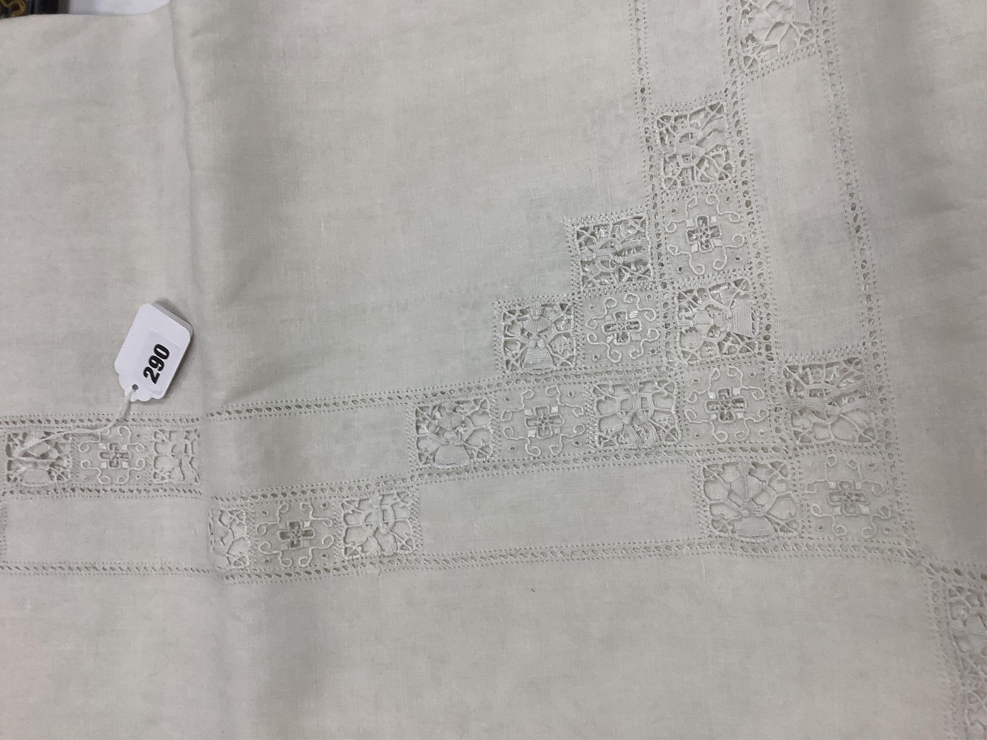 An Italian large linen drawn thread worked and embroidered table cloth, with small square needle lace insertions, 275cm long x 180cm wide. Condition - has a rust line, which maybe removed with rust remover. The cloth is